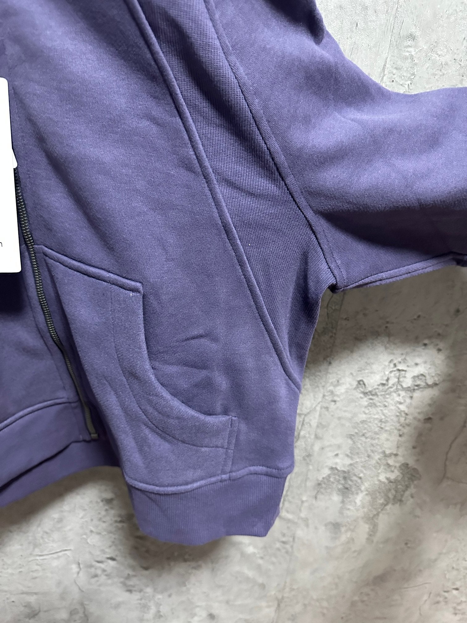 Ralph Lauren hoodie sleeve and front seam detail in dark purple