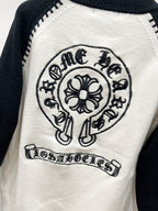 White raglan cardigan with crest mascot emblem and banner text patch.