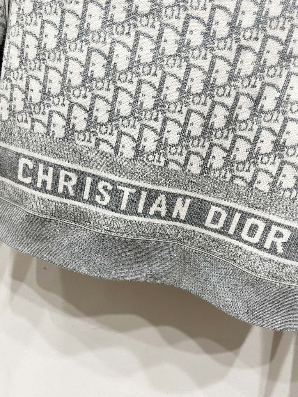 Gray Dior monogram jacket hem with CHRISTIAN DIOR logo band