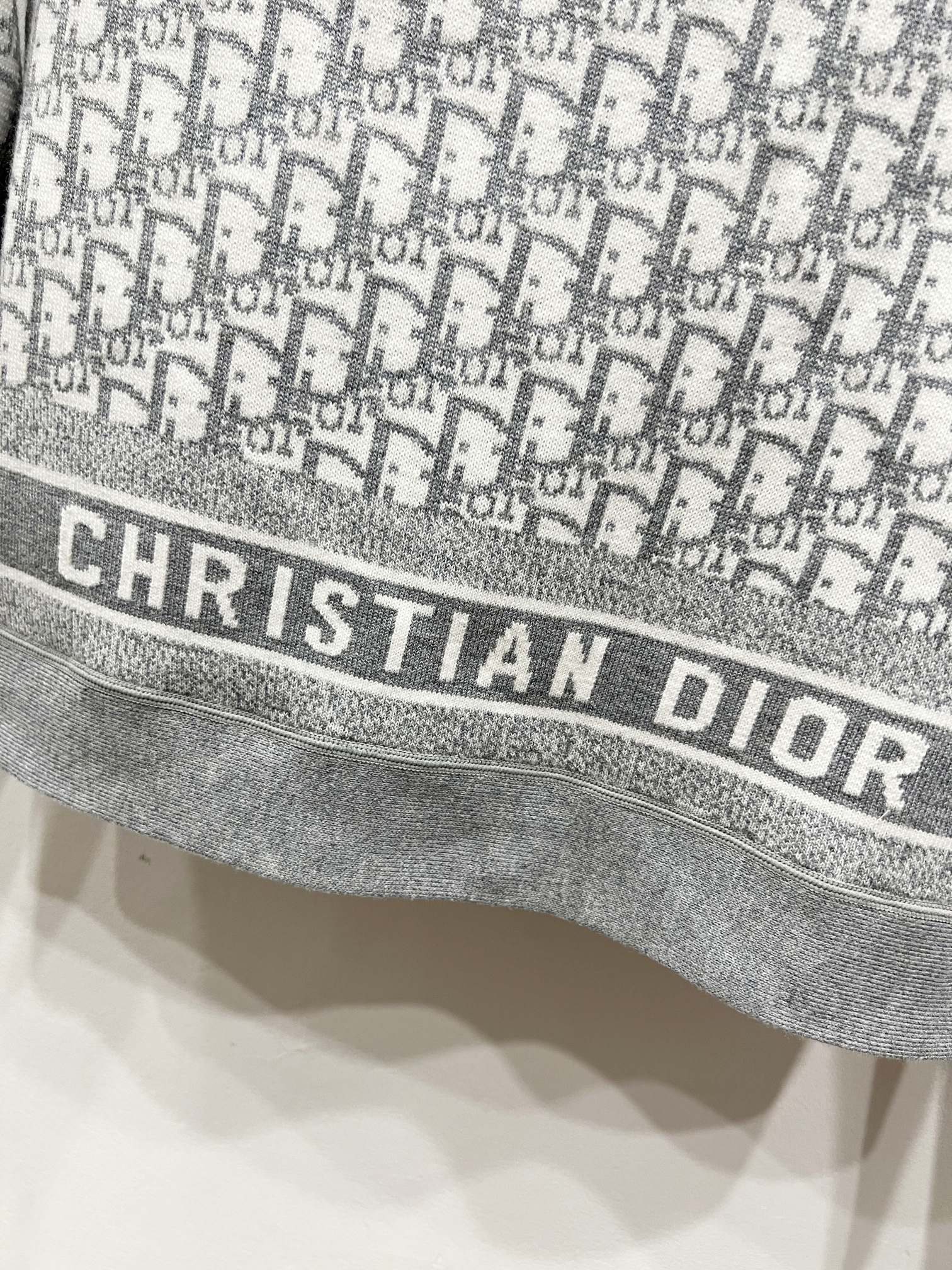 Gray Dior monogram jacket hem with CHRISTIAN DIOR logo band