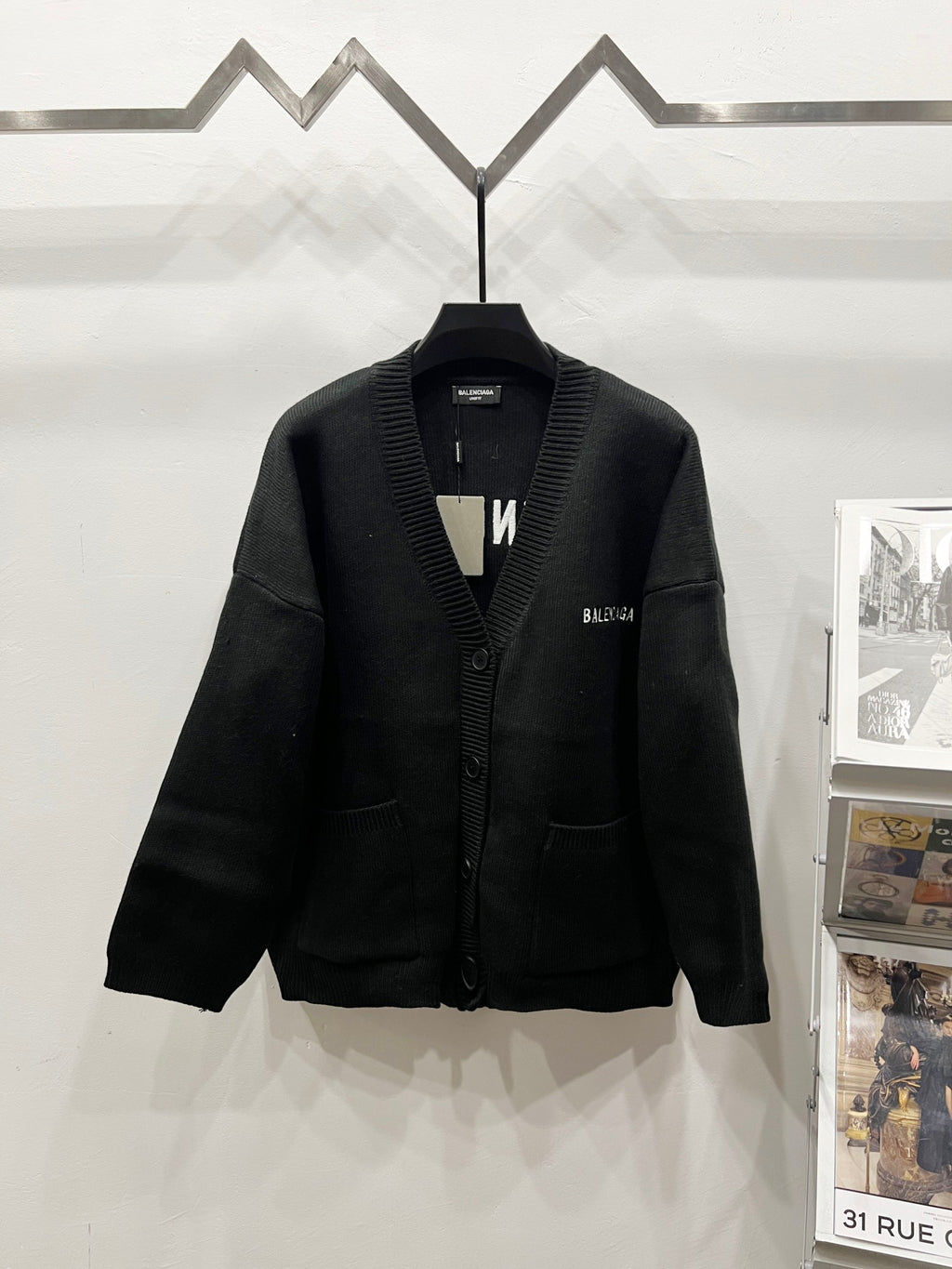 Balenciaga black knit cardigan with button front, ribbed collar and V-neck placket