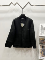 Balenciaga black knit cardigan with button front, ribbed collar and V-neck placket