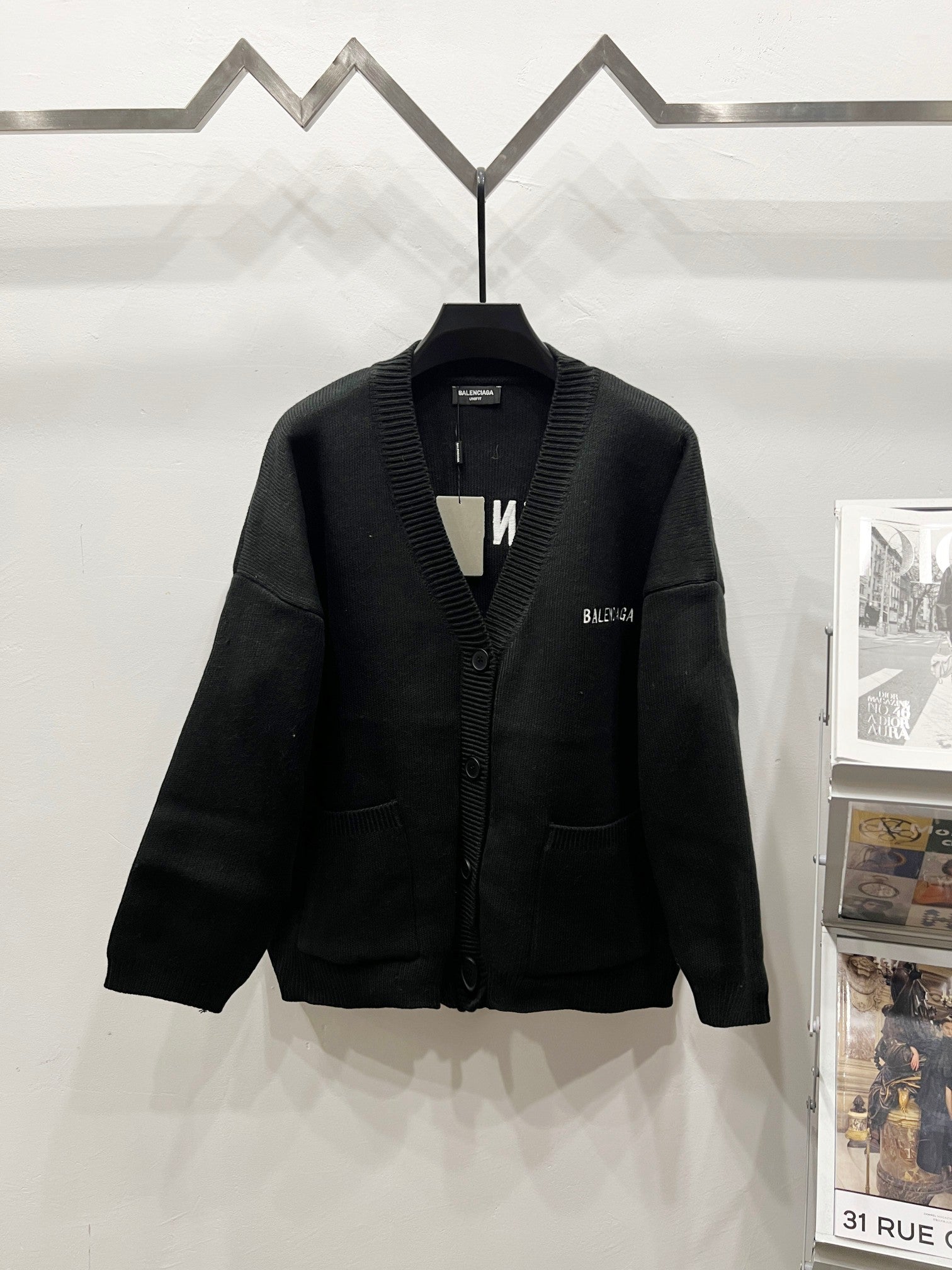 Balenciaga black knit cardigan with button front, ribbed collar and V-neck placket