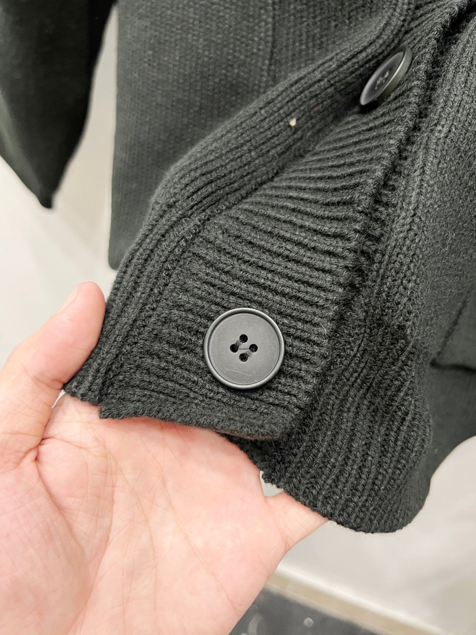 Balenciaga black knit cardigan cuff with round button and ribbed trim