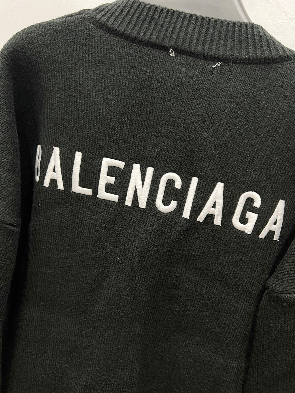 Balenciaga black knit cardigan back with BALENCIAGA lettering across upper back
