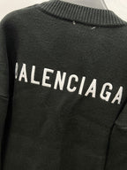 Balenciaga black knit cardigan back with BALENCIAGA lettering across upper back