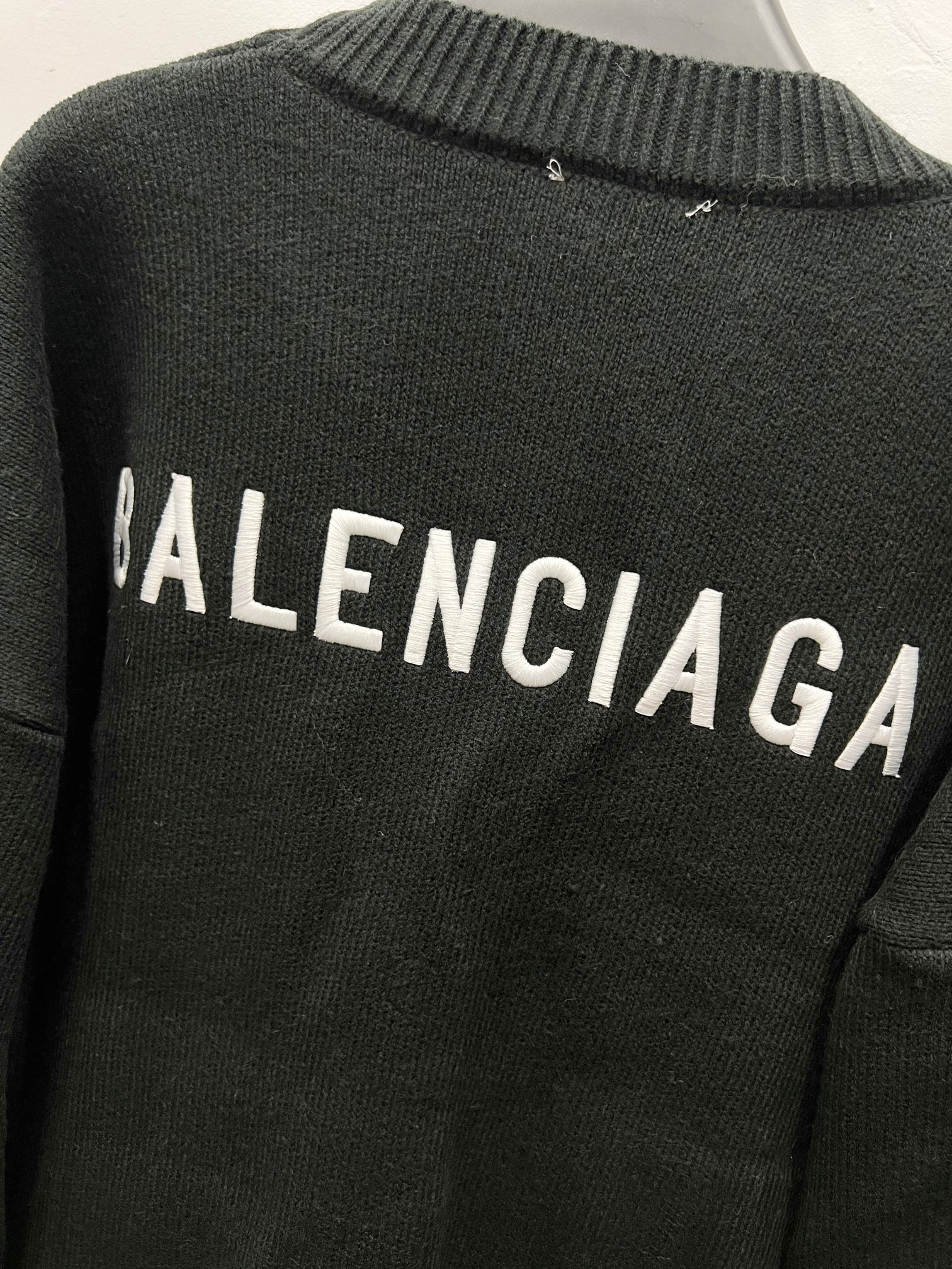 Balenciaga black knit cardigan back with BALENCIAGA lettering across upper back
