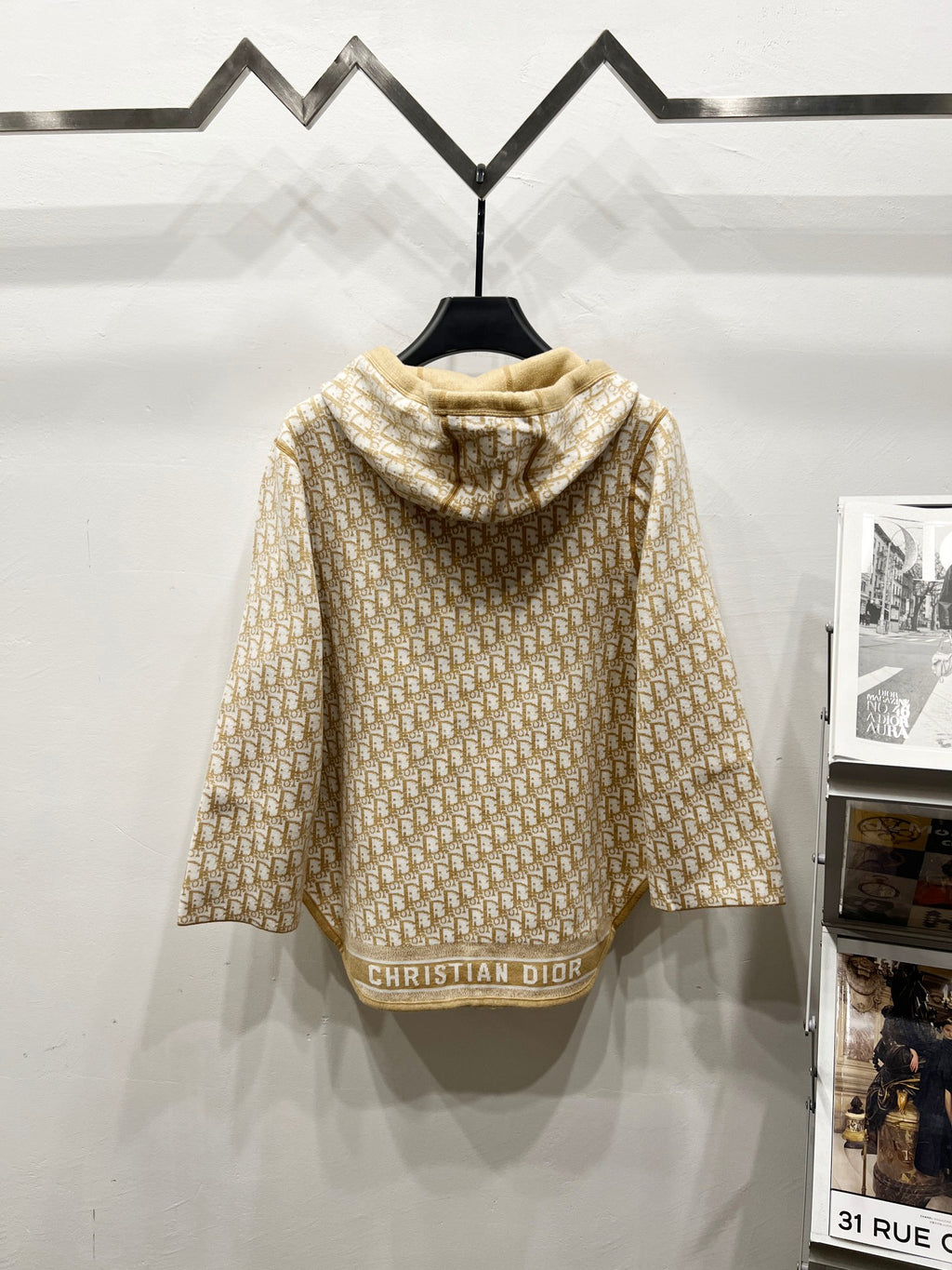 Beige hooded zip jacket back view with allover Dior logo pattern and hood pocket