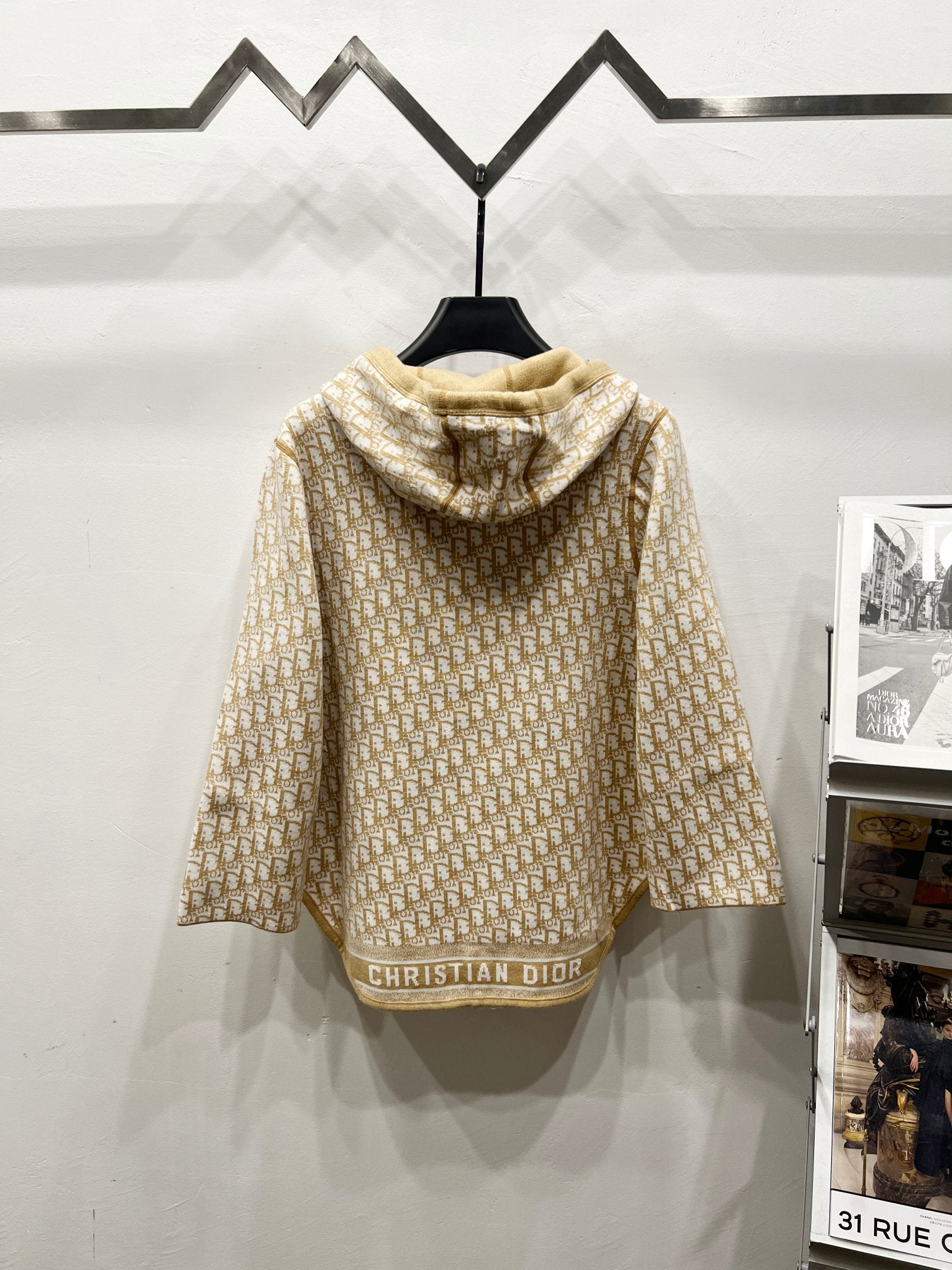 Beige hooded zip jacket back view with allover Dior logo pattern and hood pocket