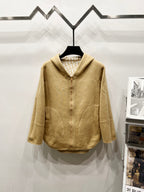 Golden hooded zip jacket with two front patch pockets and buttoned zipper placket