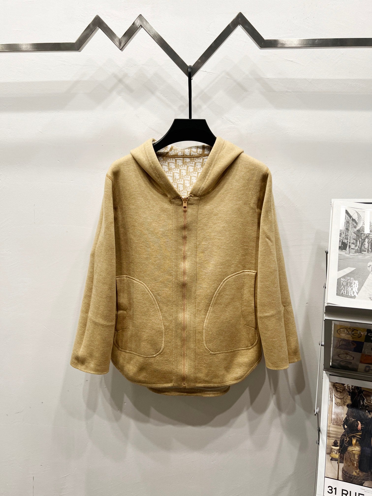 Golden hooded zip jacket with two front patch pockets and buttoned zipper placket
