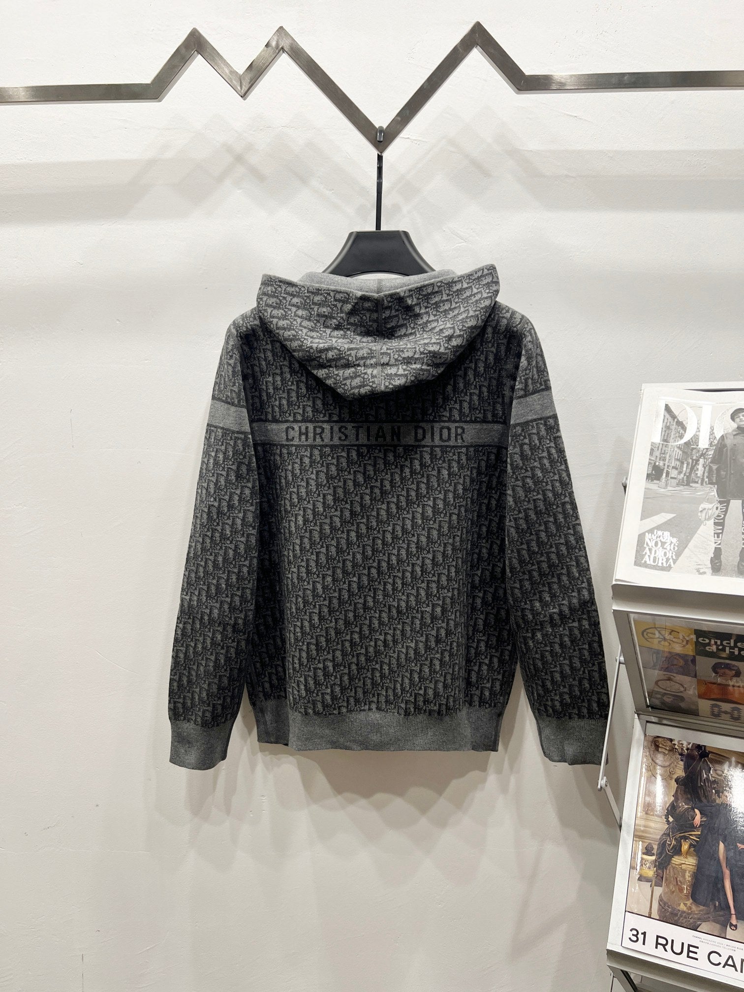 Grey hooded zip jacket with repeating logo stripe and high neck ribbed trim