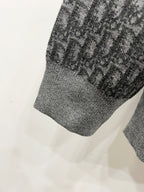 Grey ribbed hem of hooded zip jacket with repeating logo panel detail