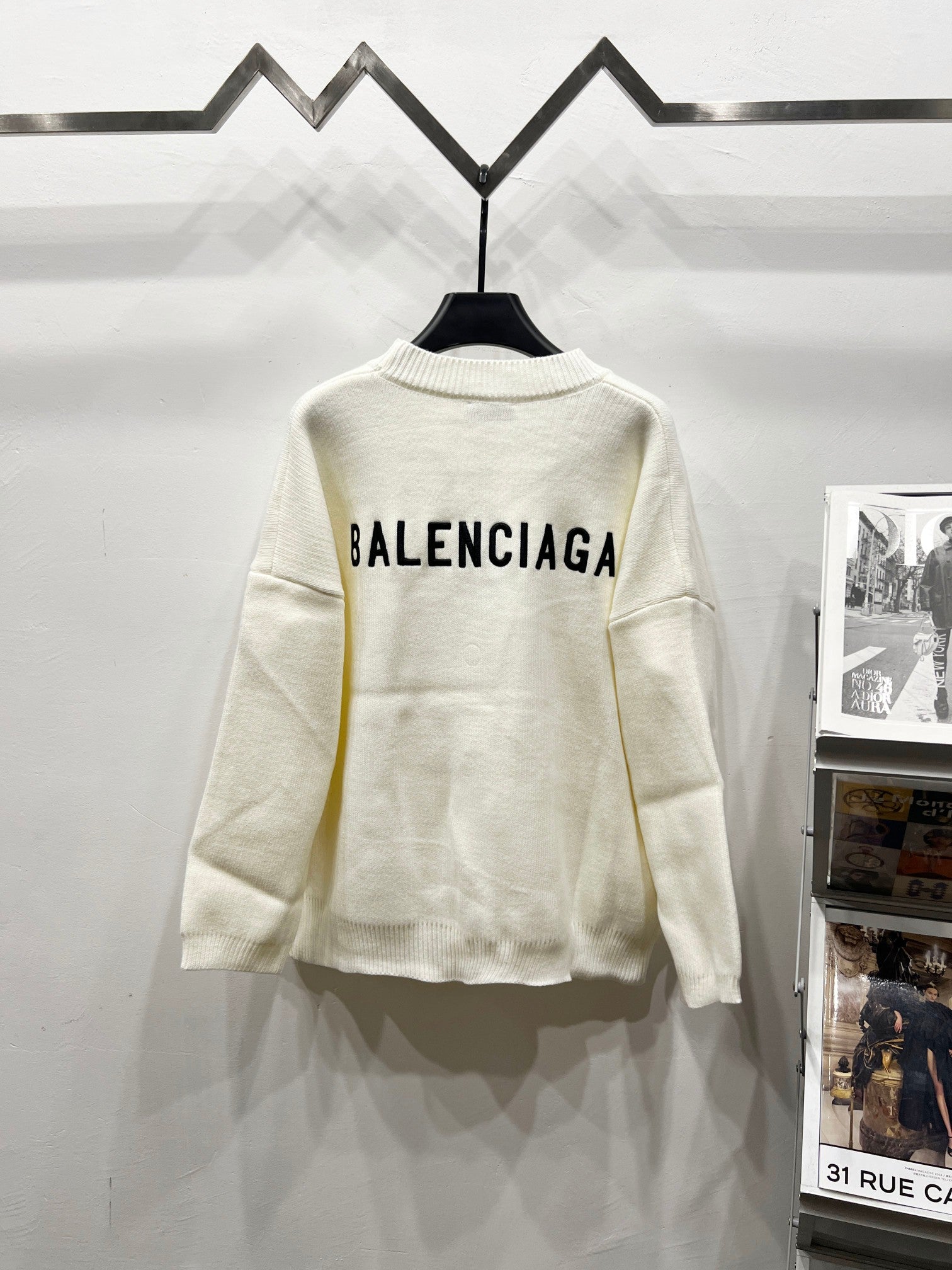 Cream knit V-neck cardigan with BALENCIAGA logo on back, long sleeves