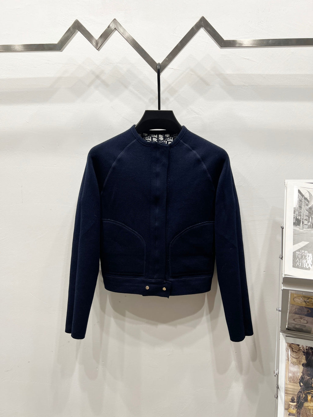 Navy long-sleeve zip jacket with ribbed waist band and stand collar