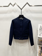 Navy long-sleeve zip jacket with ribbed waist band and stand collar