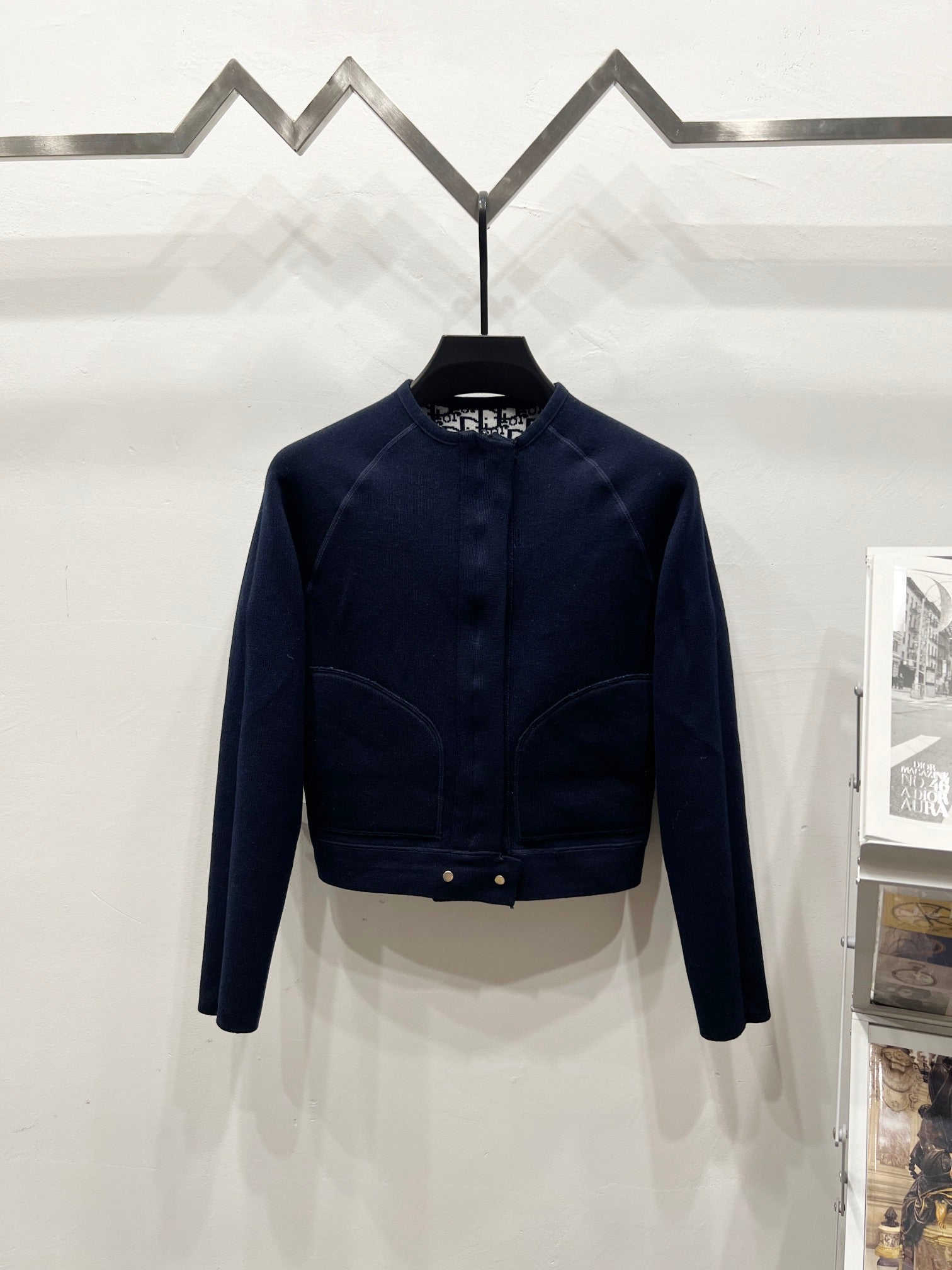 Navy long-sleeve zip jacket with ribbed waist band and stand collar