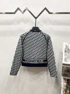 Long-sleeve patterned Dior logo zip jacket with ribbed band across the waist