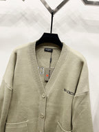 Beige V-neck knit cardigan with button placket and embroidered side logo