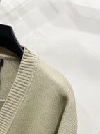 Beige knit cardigan sleeve with ribbed V-neck trim