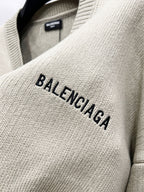 Beige knit sweater chest with embroidered BALENCIAGA lettering
