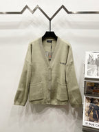 Beige knit cardigan with V-neck button front and Balenciaga logo patch