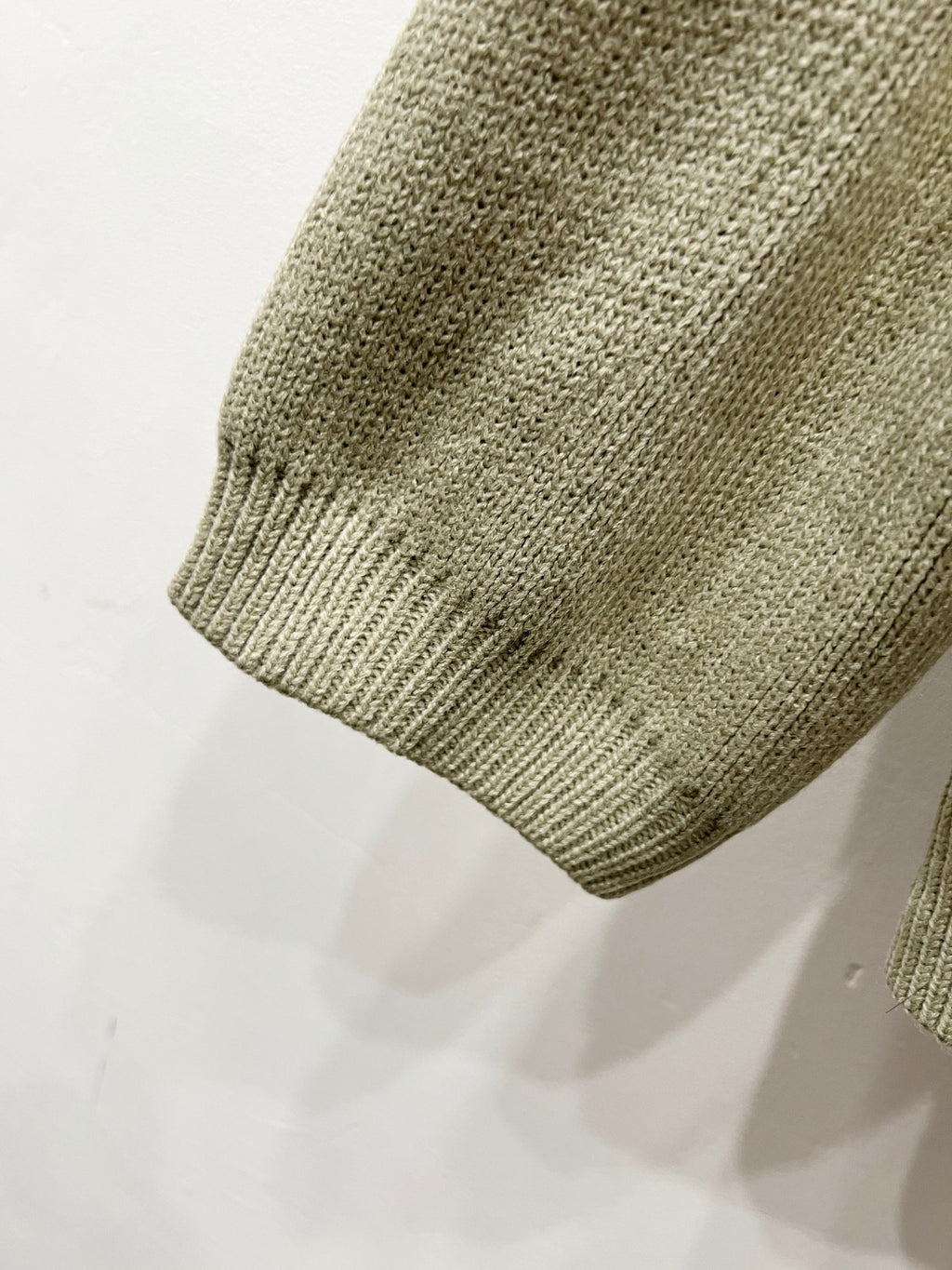 Beige knit cardigan hem with ribbed knit edge