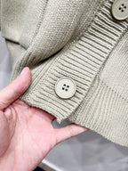 Beige knit cardigan cuff with two-button detail