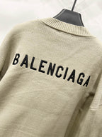Beige knit cardigan back with BALENCIAGA text and ribbed trim