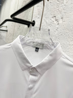 White collared button-up shirt with Dior label at neckline