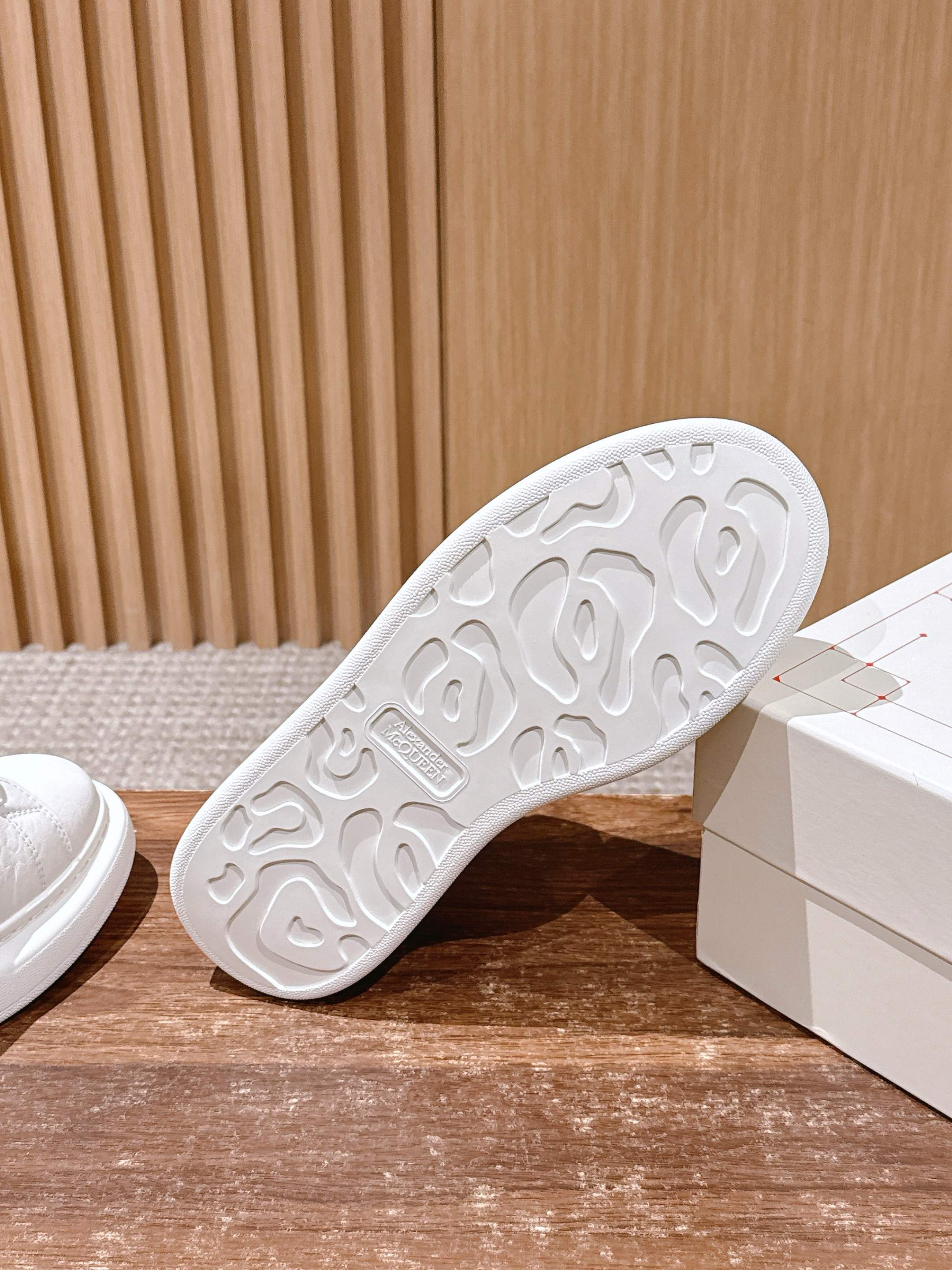 Alexander McQueen leather sneakers outsole, white, textured rubber tread pattern