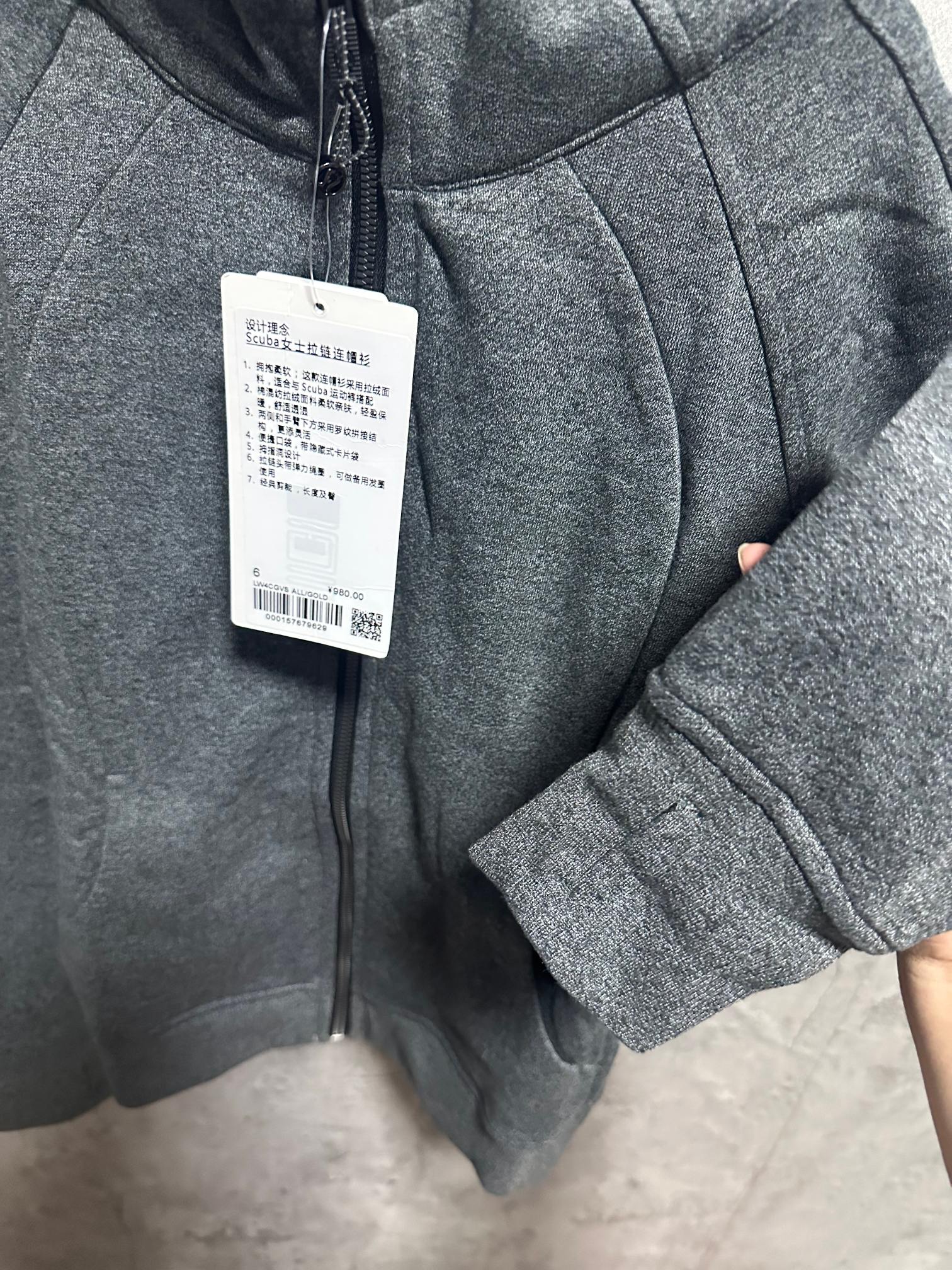 Ralph Lauren zip-up hoodie with dark gray heather fabric and size label on sleeve