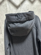 Dark gray zip-up hoodie, hood logo patch centered on back