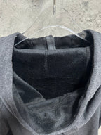 Dark gray zip-up hoodie interior lining visible at hood opening