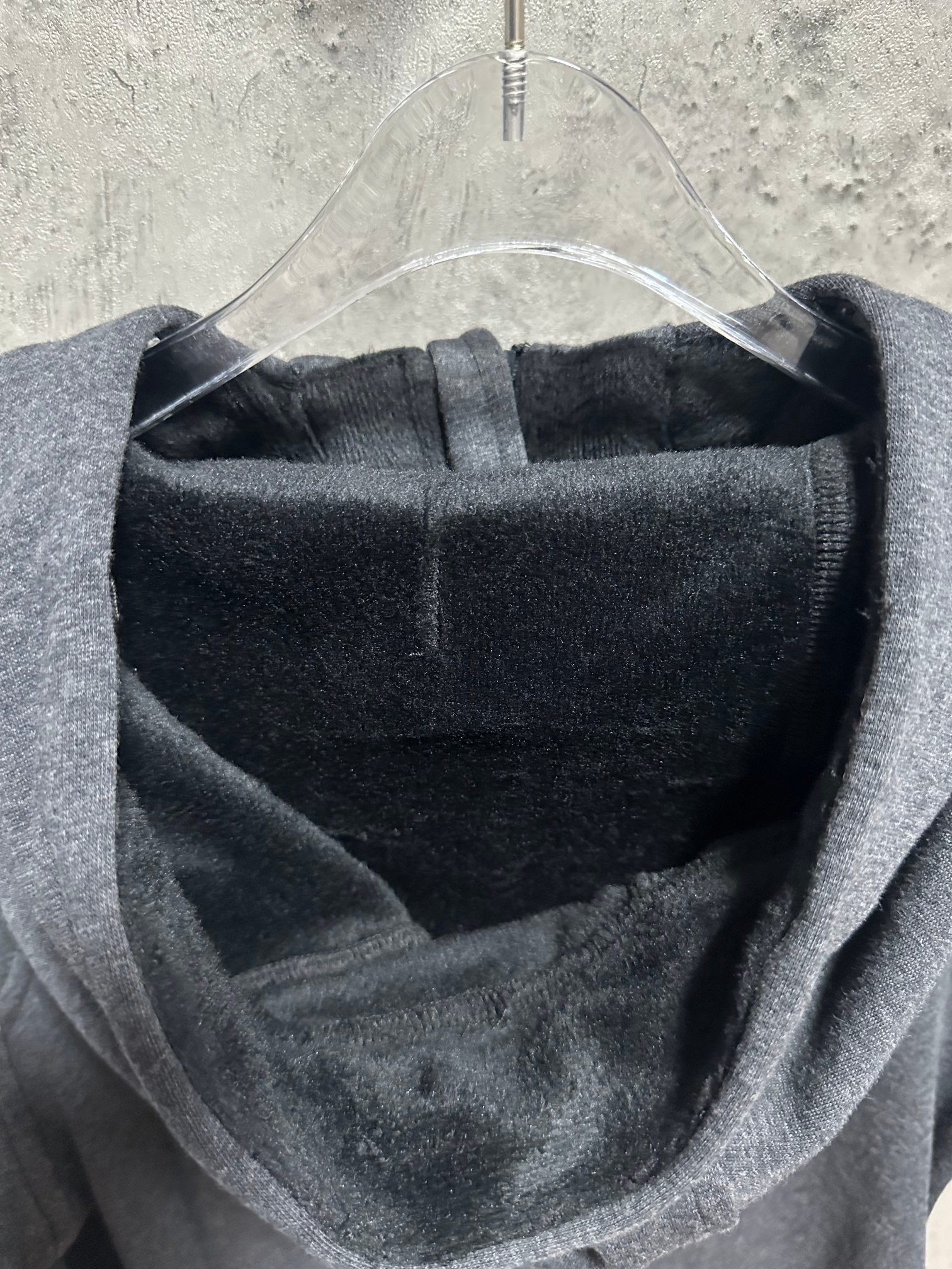 Dark gray hoodie hood interior lining with front opening and drawstring cord