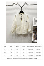 Cream knit V-neck cardigan on hanger with size chart table