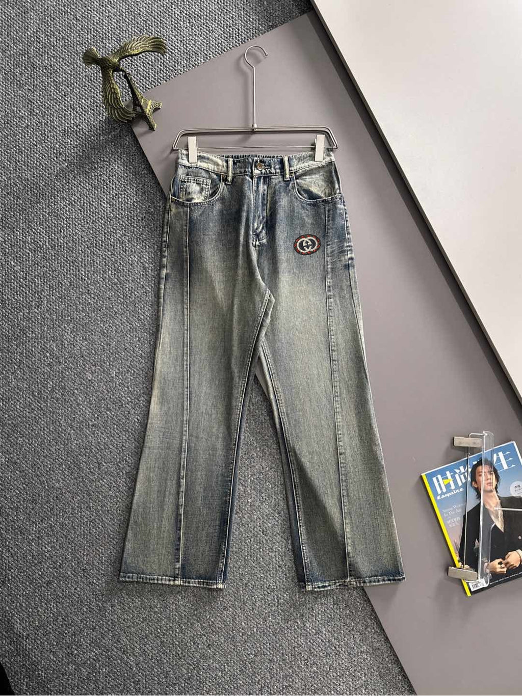 Denim pants with Gucci logo patch, button-fly, belt loops, cuffed hem