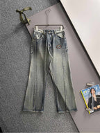 Denim pants with Gucci logo patch, button-fly, belt loops, cuffed hem
