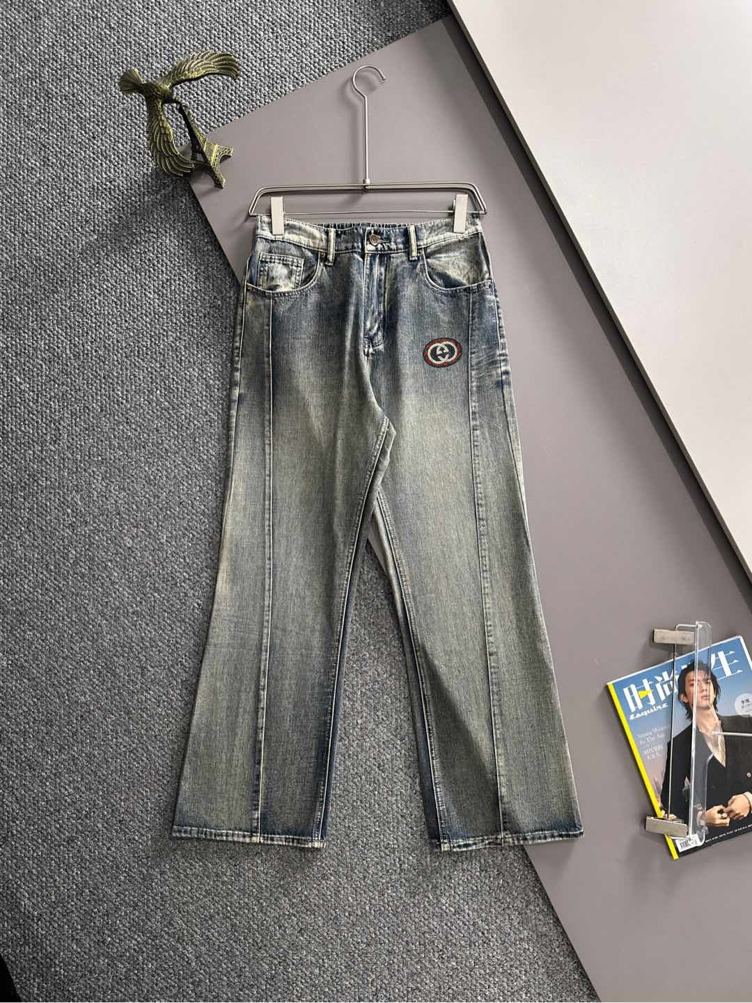 Denim pants with Gucci logo patch, button-fly, belt loops, cuffed hem