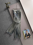 Denim pants with Gucci logo patch, front view, belt loops, button-fly