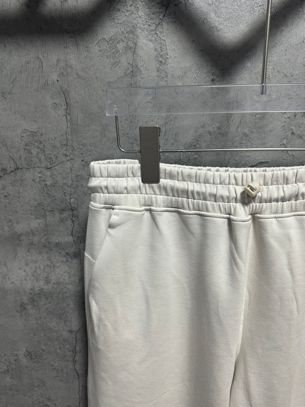 Cream sweatpants waistband with elastic ruching and interior drawstring
