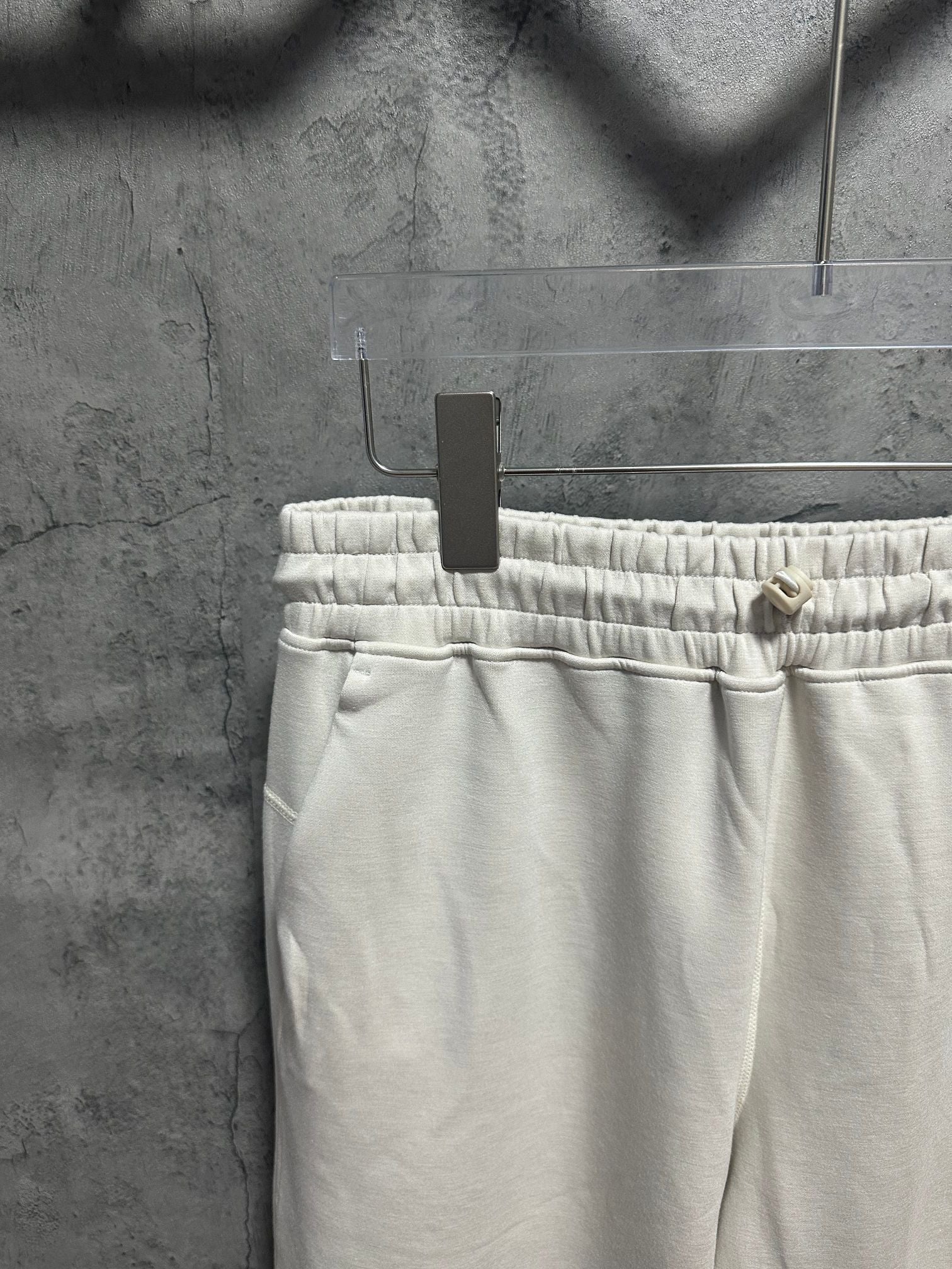 Cream sweatpants waistband with elastic ruching and interior drawstring