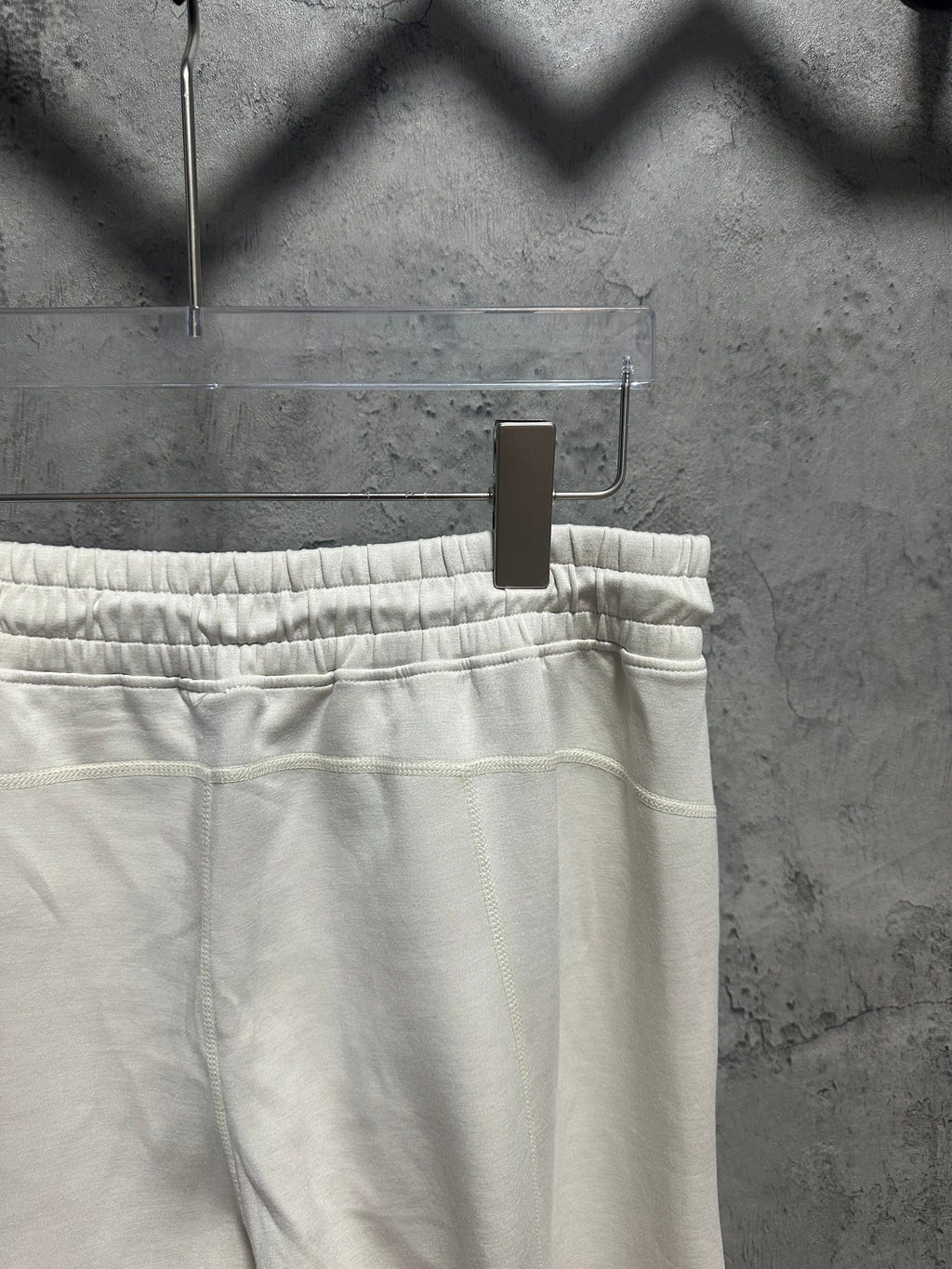 Cream sweatpants waistband with elastic ruching and straight leg cut