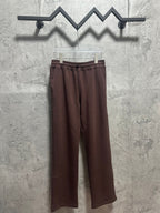 Maroon drawstring sweatpants with elastic waistband and relaxed straight legs