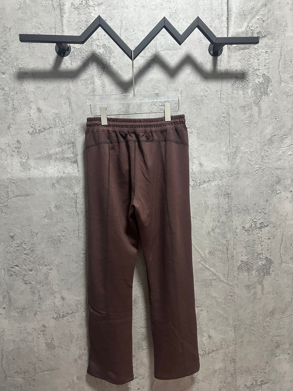 Dark brown pull-on pants with elastic waistband and relaxed straight legs