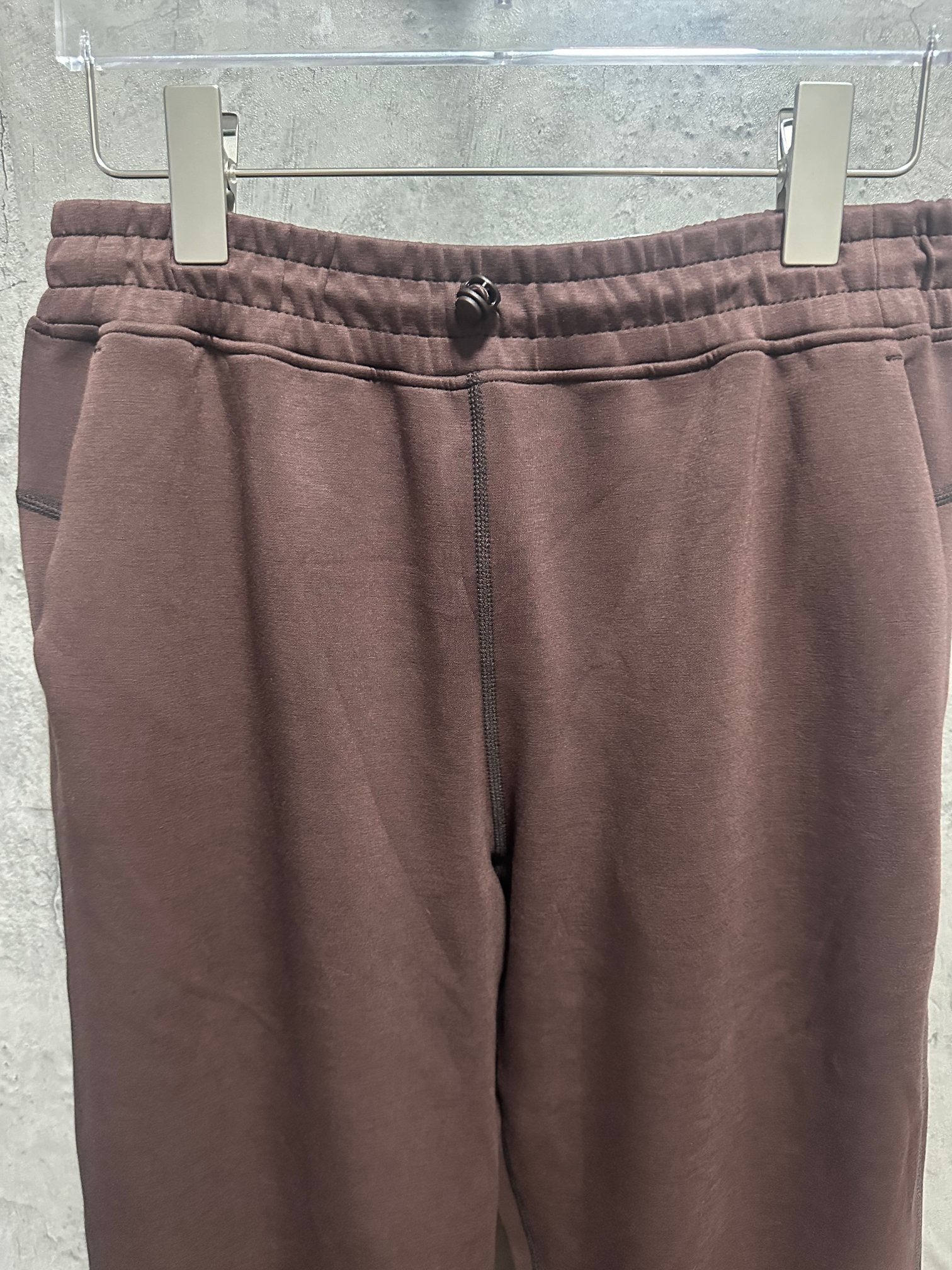 Maroon sweatpants waistband with elastic band and drawstring