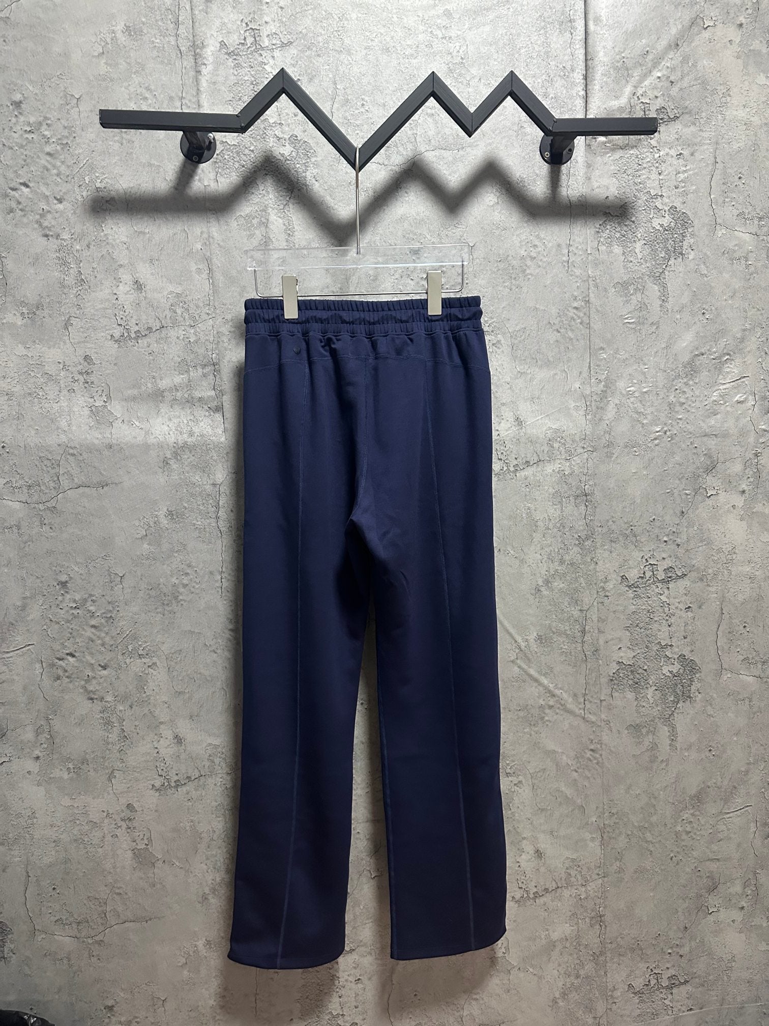 Navy elastic-waist trousers with relaxed straight-leg silhouette