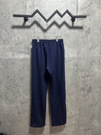 Navy pull-on pants with elastic waistband and wide, straight leg shape
