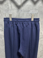 Navy wide-leg trousers with elastic waistband and front seam detailing