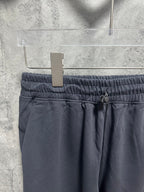 Dark blue sweatpants waistband with elastic band and drawstring